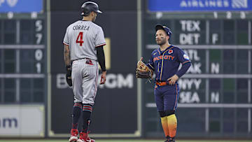 Minnesota Twins shortstop Carlos Correa (4) talks with Houston Astros second baseman Jose Altuve (27) on May 29, 2023 in Houston.