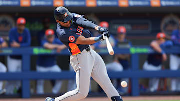 Feb 27, 2025; Port St. Lucie, Florida, USA; Houston Astros third baseman Cam Smith (90) hits a single against the New York Mets during the fourth inning at Clover Park. Mandatory Credit: Sam Navarro-Imagn Images