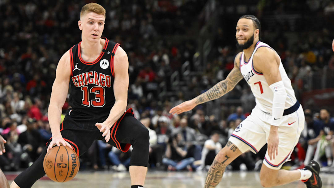 Chicago Bulls guard Kevin Huerter (13) moves the ball past LA Clippers guard Amir Coffey (7) during the second half at the United Center. Mandatory Credit: Matt Marton-Imagn Images