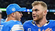 Detroit Lions quarterback Jared Goff (16) celebrates 26-20 win over Los Angeles Rams with defensive end Aidan Hutchinson (97) at Ford Field in Detroit on Sunday, September 8, 2024.