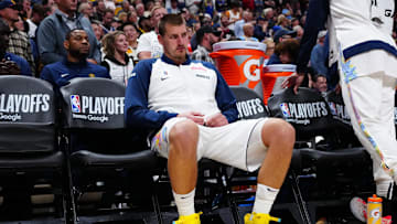 Apr 29, 2025; Denver, Colorado, USA; Denver Nuggets center Nikola Jokic (15) on the bench in the fourth quarter against the LA Clippers during game five of the first round for the 2025 NBA Playoffs at Ball Arena. Mandatory Credit: Ron Chenoy-Imagn Images