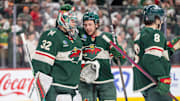Apr 24, 2025; Saint Paul, Minnesota, USA; Minnesota Wild defenseman Brock Faber (7) congratulates Minnesota Wild goaltender Filip Gustavsson (32) after after the final buzzer sounded and the Wild defeated the Vegas Golden Knights in game three of the first round of the 2025 Stanley Cup Playoffs at Xcel Energy Center. Mandatory Credit: Matt Blewett-Imagn Images