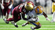 Nov 30, 2024; Chestnut Hill, Massachusetts, USA; Boston College Eagles defensive end Quintayvious Hutchins (15) tackles Pittsburgh Panthers wide receiver Kenny Johnson (2) during the second half at Alumni Stadium. Mandatory Credit: Brian Fluharty-Imagn Images