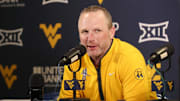 Feb 19, 2025; Morgantown, West Virginia, USA; West Virginia Mountaineers head coach Darian DeVries answers questions from the media after defeating the Cincinnati Bearcats at WVU Coliseum. Mandatory Credit: Ben Queen-Imagn Images