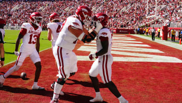 Oct 14, 2023; Tuscaloosa, Alabama, USA; Arkansas Razorbacks running back Rashod Dubinion (7) celebrates his touchdown with Arkansas Razorbacks offensive lineman Joshua Braun (78) in the end zone against the Alabama Crimson Tide during the second half at Bryant-Denny Stadium. Mandatory Credit: John David Mercer-USA TODAY Sports