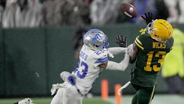 Green Bay Packers wide receiver Dontayvion Wicks (13) is unable to make a catch inbounds while bing covered by Detroit Lions cornerback Carlton Davis III (23) during the fourth quarter of their game Sunday, November 3, 2024 at Lambeau Field in Green Bay, Wisconsin. The Detroit Lions beat the Green Bay Packers 24-14.