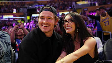 Justin Herbert and Madison Beer sit courtside at the Laker game Friday at the Staples Center. Lebron James stopped by to say hello.