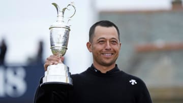 Jul 21, 2024; Ayrshire, SCT; Xander Schauffele celebrates with Claret Jug after winning the Open Championship golf tournament at Royal Troon. Mandatory Credit: Jack Gruber-USA TODAY Sports