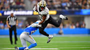 New Orleans Saints running back Kendre Miller (25) runs the ball against the Los Angeles Chargers