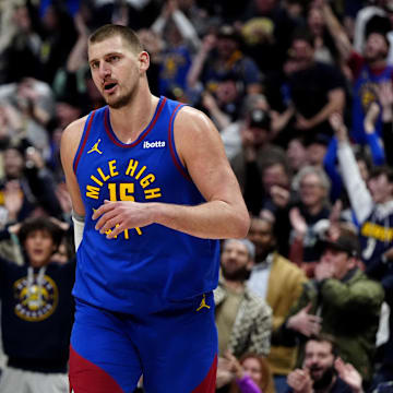 Jan 23, 2025; Denver, Colorado, USA; Denver Nuggets center Nikola Jokic (15) reacts along side forward Aaron Gordon (32)  following a full court basket made in the second half against the Sacramento Kings at Ball Arena. Mandatory Credit: Ron Chenoy-Imagn Images