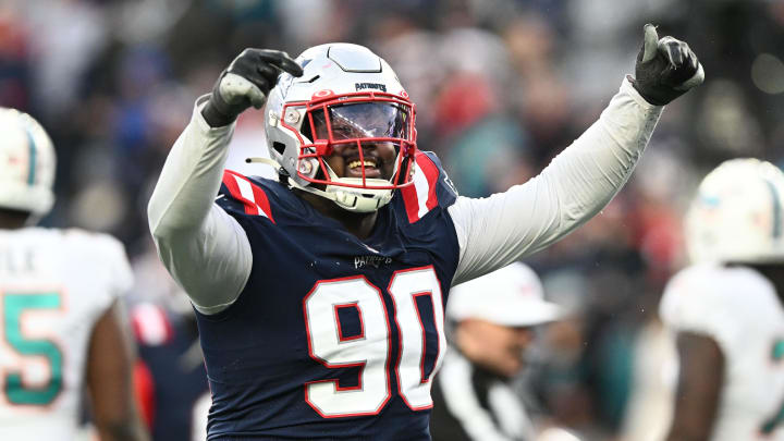 Jan 1, 2023; Foxborough, Massachusetts, USA; New England Patriots defensive tackle Christian Barmore (90) reacts after a sack against the Miami Dolphins during the second half at Gillette Stadium. Mandatory Credit: Brian Fluharty-USA TODAY Sports