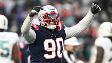 Jan 1, 2023; Foxborough, Massachusetts, USA; New England Patriots defensive tackle Christian Barmore (90) reacts after a sack against the Miami Dolphins during the second half at Gillette Stadium. Mandatory Credit: Brian Fluharty-Imagn Images