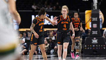Mar 8, 2025; Kansas City, MO, USA; Oklahoma State Cowgirls guard Jadyn Wooten (6) and guard Anna Gret Asi (4) high five after a play against the Baylor Lady Bears in the second half at T-Mobile Center. Mandatory Credit: Amy Kontras-Imagn Images