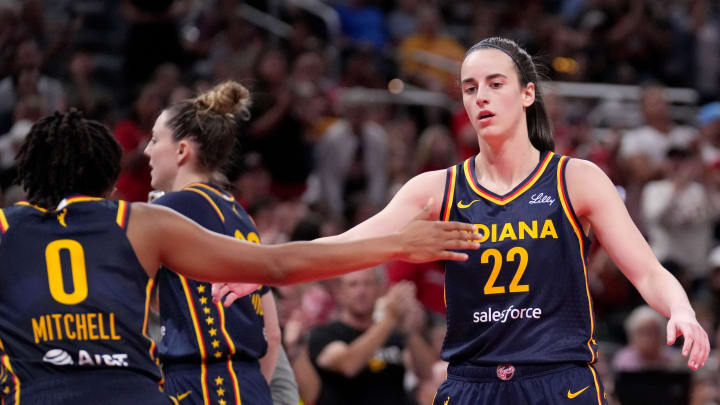 Indiana Fever guard Caitlin Clark (22) and guard Kelsey Mitchell (0) celebrate during the first half of a game Sunday, Aug. 18, 2024, at Gainbridge Fieldhouse in Indianapolis.