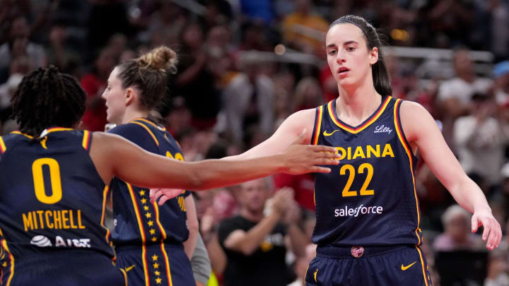 Indiana Fever guard Caitlin Clark (22) and guard Kelsey Mitchell (0) celebrate