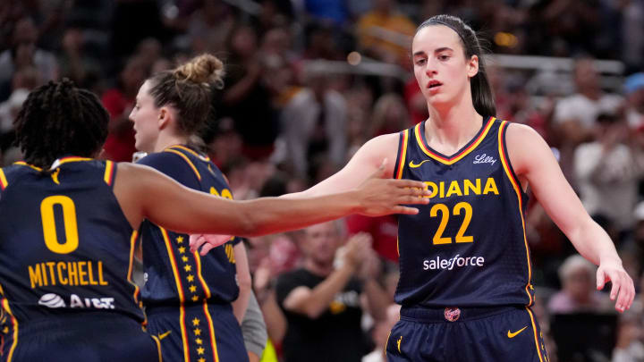 Indiana Fever guard Caitlin Clark (22) and guard Kelsey Mitchell (0) celebrate 