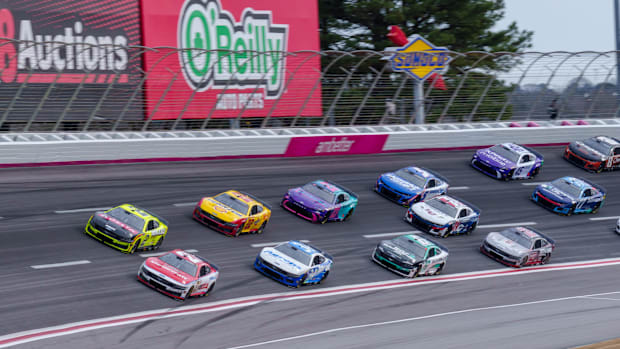 Josh Berry (21) fights to maintain the lead going into turn four at Atlanta Motor Speedway. 