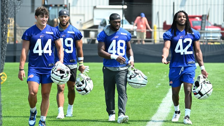 Jul 24, 2024; Rochester, NY, USA; Buffalo Bills linebacker Joe Andreessen (44) and linebacker Shayne Simon (49) and linebacker Edefuan Ulofoshio (48) and linebacker Dorian Williams (42) leave the field after practice during training camp at St. John Fisher University. Mandatory Credit: Mark Konezny-USA TODAY Sports