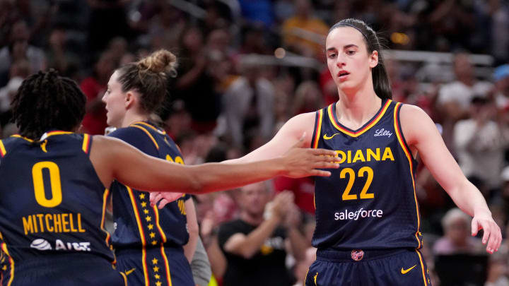 Indiana Fever guard Caitlin Clark (22) and guard Kelsey Mitchell (0) celebrate during the first half of a game Sunday, Aug. 18, 2024, at Gainbridge Fieldhouse in Indianapolis.