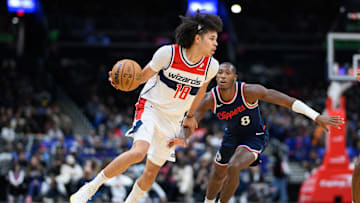 Nov 27, 2024; Washington, District of Columbia, USA; Washington Wizards forward Kyshawn George (18) drives to the basket against LA Clippers guard Kris Dunn (8) during the second quarter at Capital One Arena. Mandatory Credit: Reggie Hildred-Imagn Images