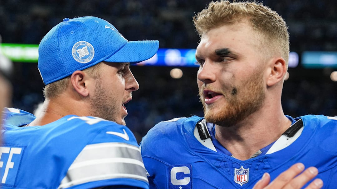 Detroit Lions quarterback Jared Goff (16) celebrates a 26-20 win over the Los Angeles Rams with defensive end Aidan Hutchinson (97) at Ford Field.