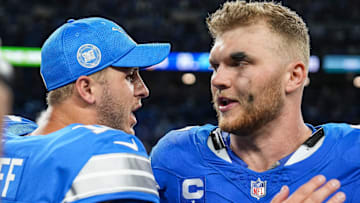 Detroit Lions quarterback Jared Goff (16) celebrates a 26-20 win over the Los Angeles Rams with defensive end Aidan Hutchinson (97) at Ford Field.