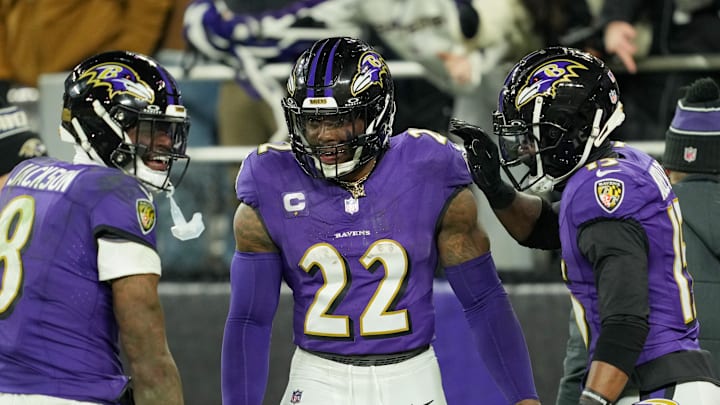 Baltimore Ravens running back Derrick Henry celebrates with wide receiver Nelson Agholor and quarterback Lamar Jackson after scoring a touchdown.