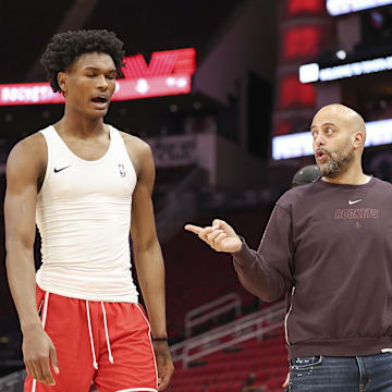 Jan 6, 2024; Houston, Texas, USA; Houston Rockets general manager Rafael Stone (right) talks with Rockets forward Amen Thompson (1)