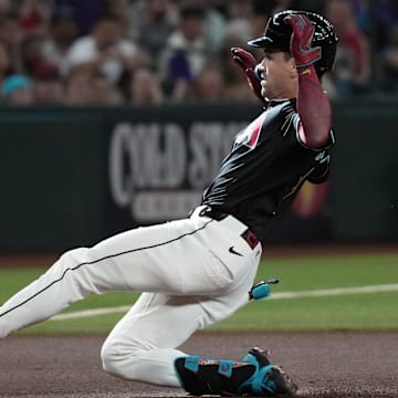 Jul 19, 2025; Phoenix, Arizona, USA; Arizona Diamondbacks outfielder Corbin Carroll (7) hits a triple against the St. Louis Cardinals in the first inning at Chase Field. Mandatory Credit: Rick Scuteri-Imagn Images