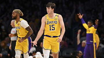 Nov 8, 2024; Los Angeles, California, USA; Los Angeles Lakers guard Austin Reaves (15) reacts after shooting a three point basket against the Philadelphia 76ers during the first half at Crypto.com Arena. Mandatory Credit: Jonathan Hui-Imagn Images