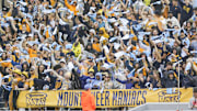 Sep 27, 2025; Morgantown, West Virginia, USA; West Virginia Mountaineers students cheer during the first quarter against the Utah Utes at Milan Puskar Stadium. Mandatory Credit: Ben Queen-Imagn Images