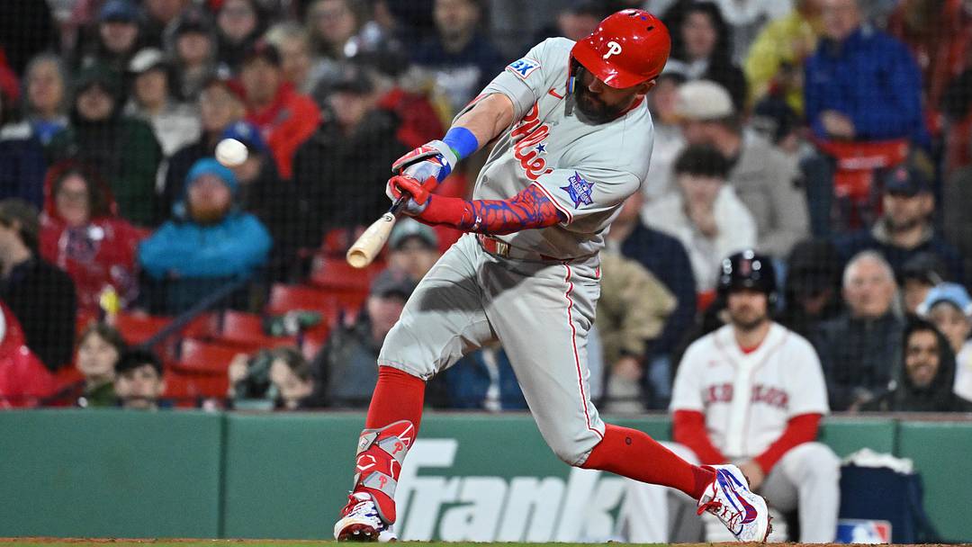 Philadelphia Phillies designated hitter Kyle Schwarber hits a two run home run  during the eighth inning against the Boston Red Sox at Fenway Park.
