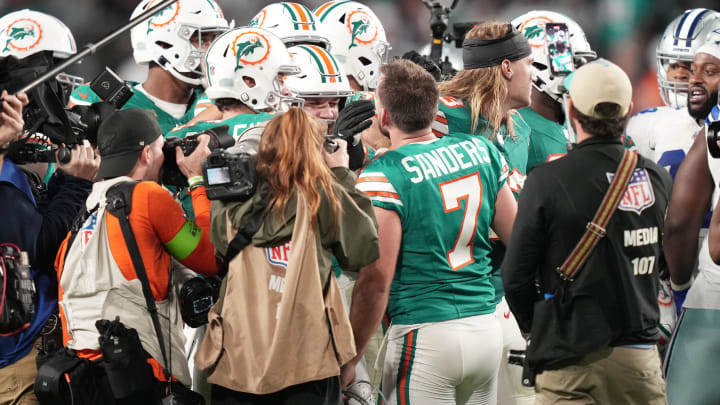 Miami Dolphins place kicker Jason Sanders (7) is congratulated by teammates after kicking the game-winning field goal against the Dallas Cowboys during an NFL game at Hard Rock Stadium in Miami Gardens, Dec. 24, 2023.