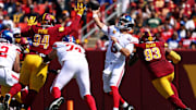 Sep 15, 2024; Landover, Maryland, USA; New York Giants quarterback Daniel Jones (8) throws a pass against the Washington Commanders during the second quarter at Commanders Field.  