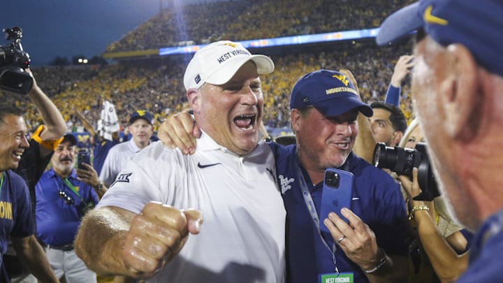 Sep 13, 2025; Morgantown, West Virginia, USA; West Virginia Mountaineers head coach Rich Rodriguez celebrates after defeating the Pittsburgh Panthers at Milan Puskar Stadium. Mandatory Credit: Ben Queen-Imagn Images