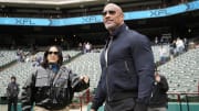 Feb 18, 2023; Arlington, TX, USA; XFL owners Dany Garcia and Dwayne Johnson stand on the field.
