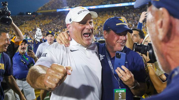 Sep 13, 2025; Morgantown, West Virginia, USA; West Virginia Mountaineers head coach Rich Rodriguez celebrates after defeating the Pittsburgh Panthers at Milan Puskar Stadium. Mandatory Credit: Ben Queen-Imagn Images