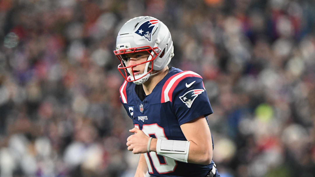 Jan 4, 2026; Foxborough, Massachusetts, USA; New England Patriots quarterback Drake Maye (10) runs off the field against the Miami Dolphins during the first quarter at Gillette Stadium. Mandatory Credit: Brian Fluharty-Imagn Images