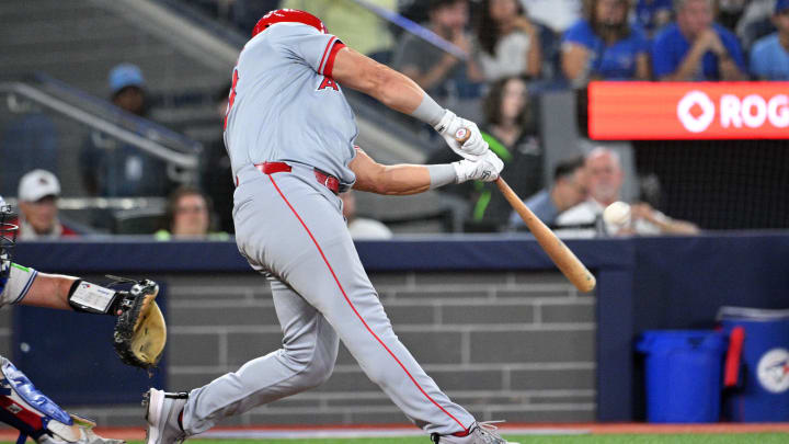 Aug 22, 2024; Toronto, Ontario, CAN;  Los Angeles Angels designated hitter Niko Kavadas (28) hits a three run home run against the Toronto Blue Jays in the ninth inning at Rogers Centre. Mandatory Credit: Dan Hamilton-USA TODAY Sports