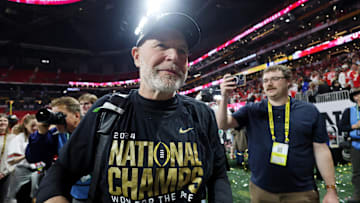 Jan 20, 2025; Atlanta, GA, USA; Ohio State Buckeyes defensive coordinator Jim Knowles celebrates after winning against the Notre Dame Fighting Irish in the CFP National Championship college football game at Mercedes-Benz Stadium. Mandatory Credit: Brett Davis-Imagn Images  