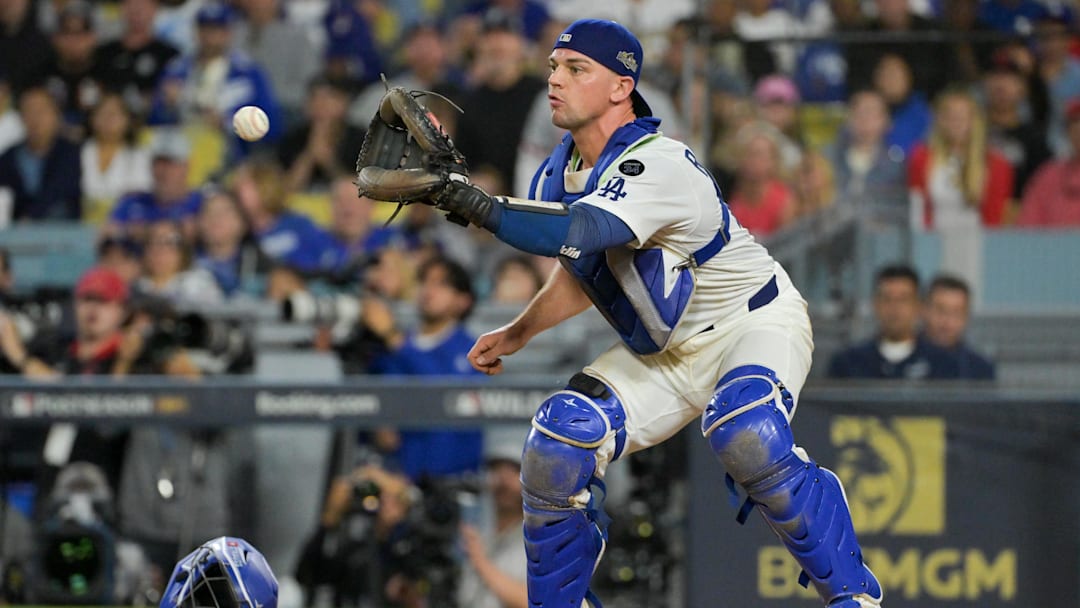 Oct 1, 2025; Los Angeles, California, USA; Los Angeles Dodgers catcher Ben Rortvedt (47) fields a throw to make an out at home plate against the Cincinnati Reds in the sixth inning during game two of the Wildcard round for the 2025 MLB playoffs at Dodger Stadium. Mandatory Credit: Jayne Kamin-Oncea-Imagn Images