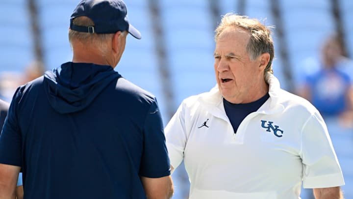 Sep 13, 2025; Chapel Hill, North Carolina, USA; North Carolina Tar Heels head coach Bill Belichick greets Richmond Spiders head coach Russ Huesman before the game at Kenan Stadium. Mandatory Credit: Bob Donnan-Imagn Images
