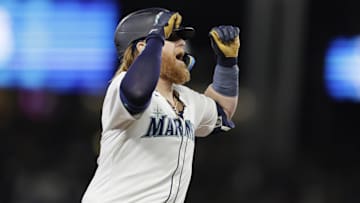 Sep 18, 2024; Seattle, Washington, USA; Seattle Mariners first baseman Justin Turner celebrates his solo home run against the New York Yankees during the eighth inning at T-Mobile Park. Mandatory Credit: John Froschauer-Imagn Images
