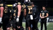 Vanderbilt quarterback Diego Pavia (2) watches the game as a bystander on the field during the Vanderbilt Football Black and Gold Spring Game at FirstBank Stadium in Nashville, Tenn., Saturday, April 12, 2025.