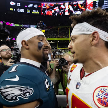 Feb 9, 2025; New Orleans, LA, USA; Philadelphia Eagles quarterback Jalen Hurts (1) greets Kansas City Chiefs quarterback Patrick Mahomes (15) following Super Bowl LIX at Ceasars Superdome. Mandatory Credit: Mark J. Rebilas-Imagn Images