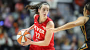 Sep 25, 2024; Uncasville, Connecticut, USA; Indiana Fever guard Caitlin Clark (22) possesses the ball during the first half against the Connecticut Sun during game two of the first round of the 2024 WNBA Playoffs at Mohegan Sun Arena. Mandatory Credit: Paul Rutherford-Imagn Images