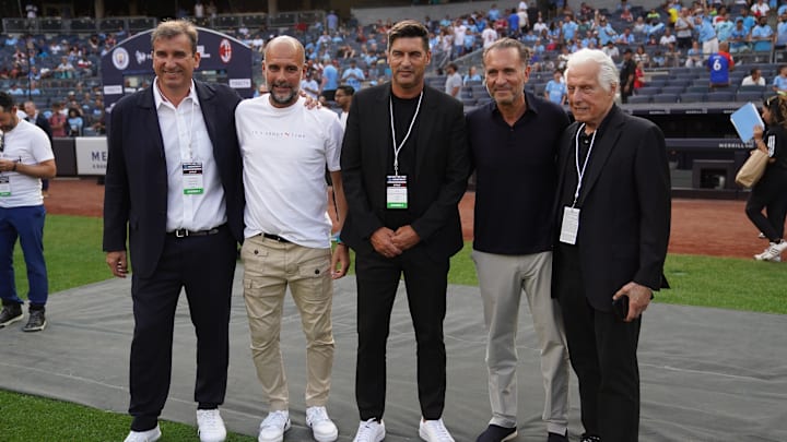 Jul 27, 2024; New York, NY, USA; From left, Ferran Soriano, Manchester City head coach Pep Guardiola, AC Milan head coach Paulo Fonseca, AC Milan owner Gerry Cardinale and Marty Edelman take a photo before the match between AC Milan and Manchester City at Yankee Stadium. Mandatory Credit: Lucas Boland-Imagn Images Jul 27, 2024; New York, NY, USA; From left, Ferran Soriano, Manchester City head coach Pep Guardiola, AC Milan head coach Paulo Fonseca, AC Milan owner Gerry Cardinale and Marty Edelman take a photo before the match between AC Milan and Manchester City at Yankee Stadium. Mandatory Credit: Lucas Boland-Imagn Images