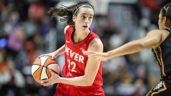Sep 25, 2024; Uncasville, Connecticut, USA; Indiana Fever guard Caitlin Clark (22) possesses the ball during the first half against the Connecticut Sun during game two of the first round of the 2024 WNBA Playoffs at Mohegan Sun Arena. Mandatory Credit: Paul Rutherford-Imagn Images