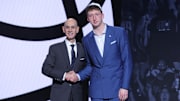 Jun 25, 2025; Brooklyn, NY, USA;  Danny Wolf stands with NBA commissioner Adam Silver after being selected as the 27th pick by the Brooklyn Nets in the first round of the 2025 NBA Draft at Barclays Center. Mandatory Credit: Brad Penner-Imagn Images