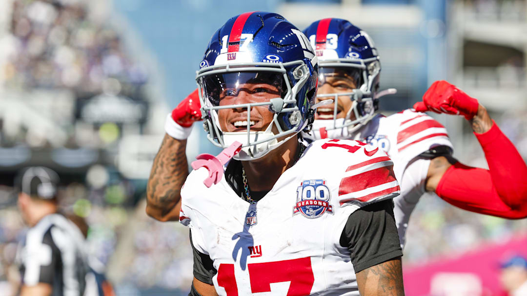 Oct 6, 2024; Seattle, Washington, USA; New York Giants wide receiver WanDale Robinson (17) celebrates after catching a touchdown pass against the Seattle Seahawks during the second quarter at Lumen Field. Mandatory Credit: Joe Nicholson-Imagn Images